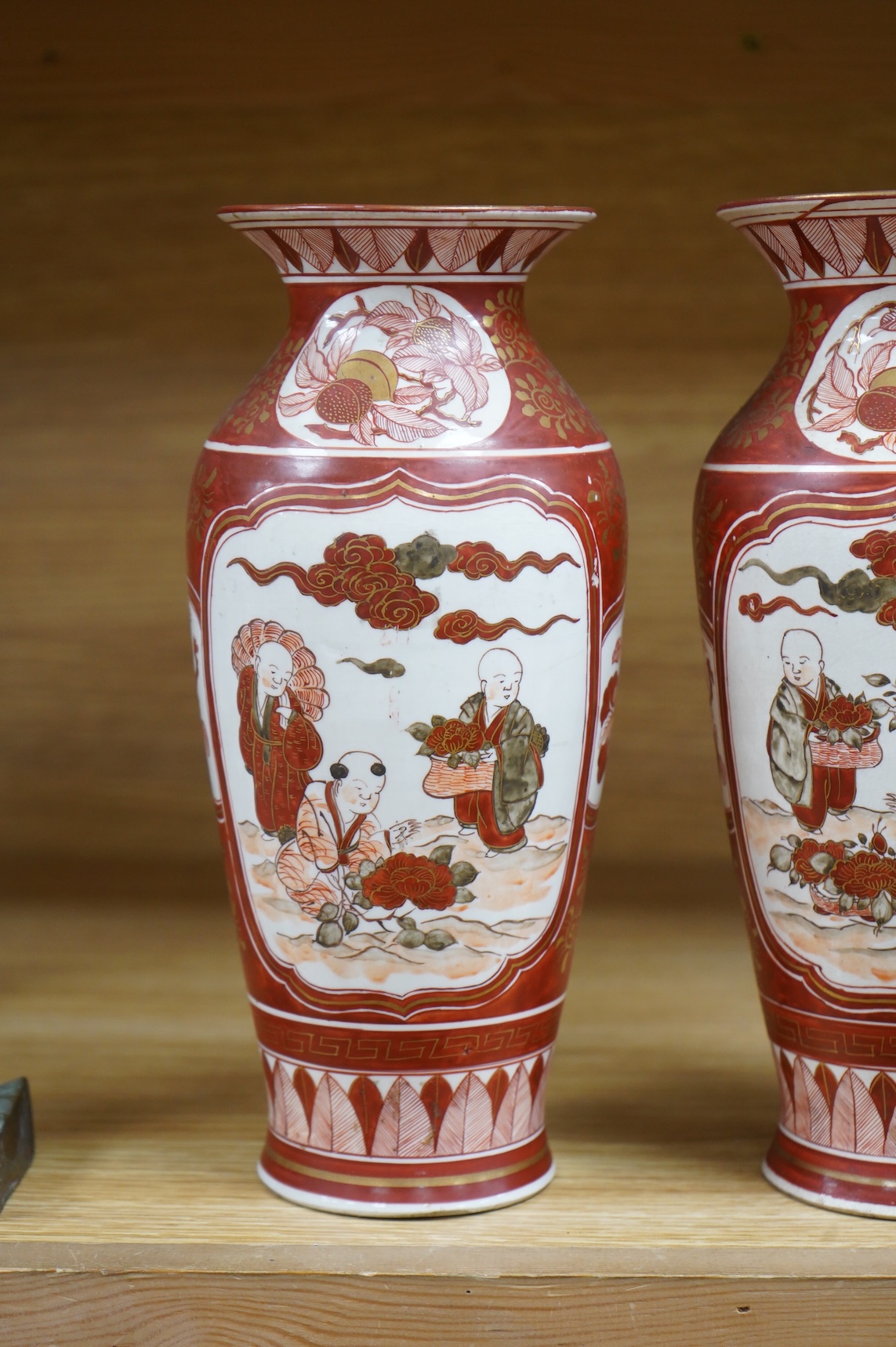 A pair of Japanese Kutani vases, signed, Meiji period (1868-1912), 25cm